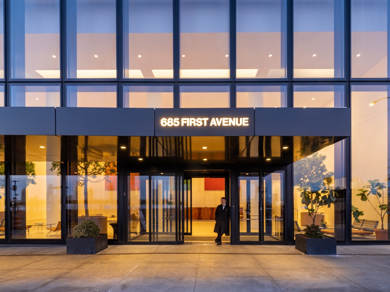 Upscale building entrance with doorman at 685 First Avenue apartment building in Murray Hill.orman