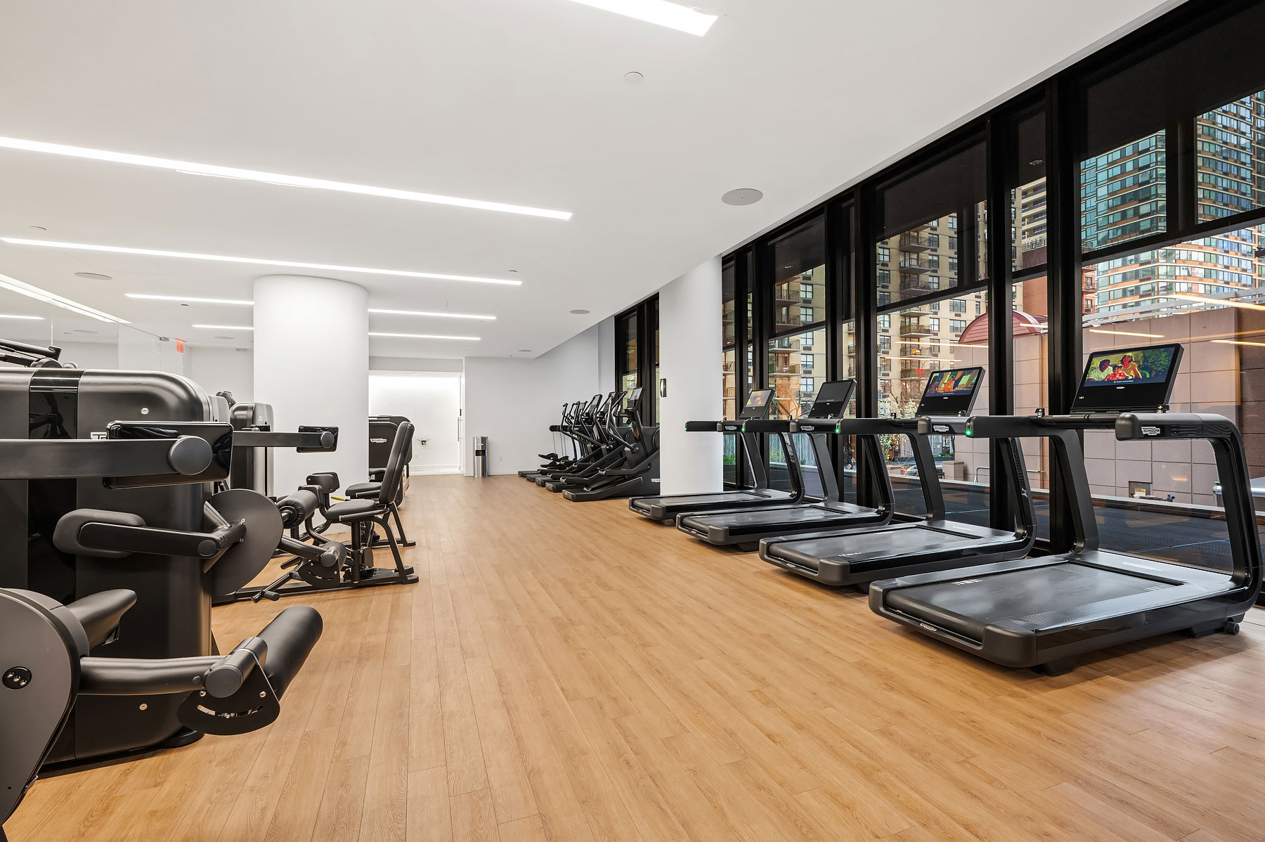 Luxury fitness center amenity with modern equipment and natural light, 685 First Avenue, Murray Hill apartments for rent