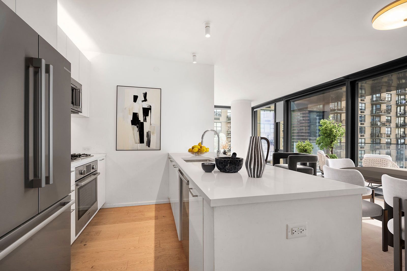 Modern open kitchen with new stainless steel appliances and modern design at 685 1st ave, apartments for rent in Murray Hill.